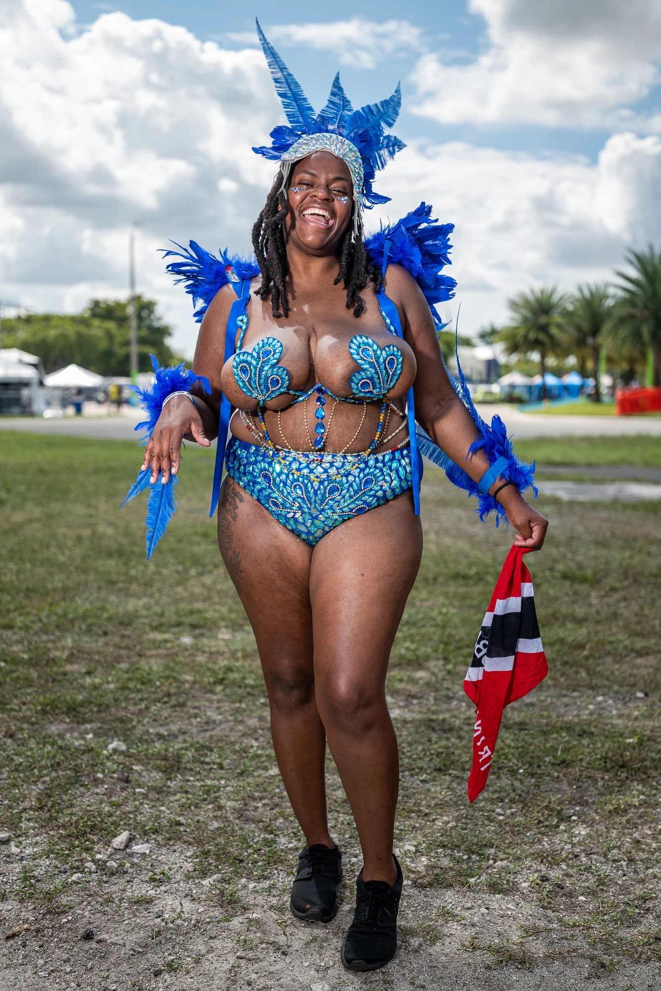 Cinematic wide frame from a Miami-Dade nonprofit shoot — late afternoon light over a community gathering